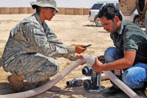 two people working on a clean water system in the desert Blue Earth Products The Science of Safe Water