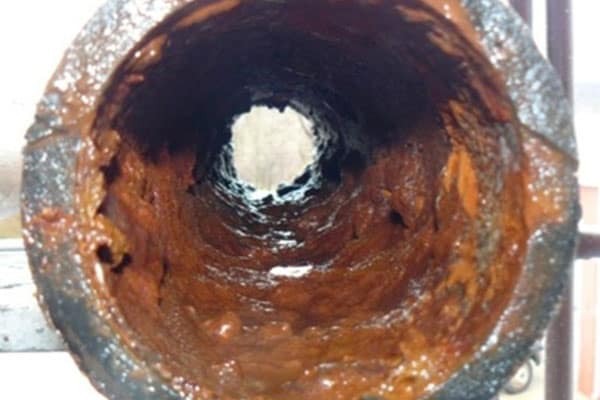 Card Biofilm Services showing a pipe with a lot of buildup Blue Earth Products