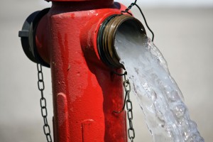 water flows out of a hydrant Blue Earth Products The Science of Safe Water