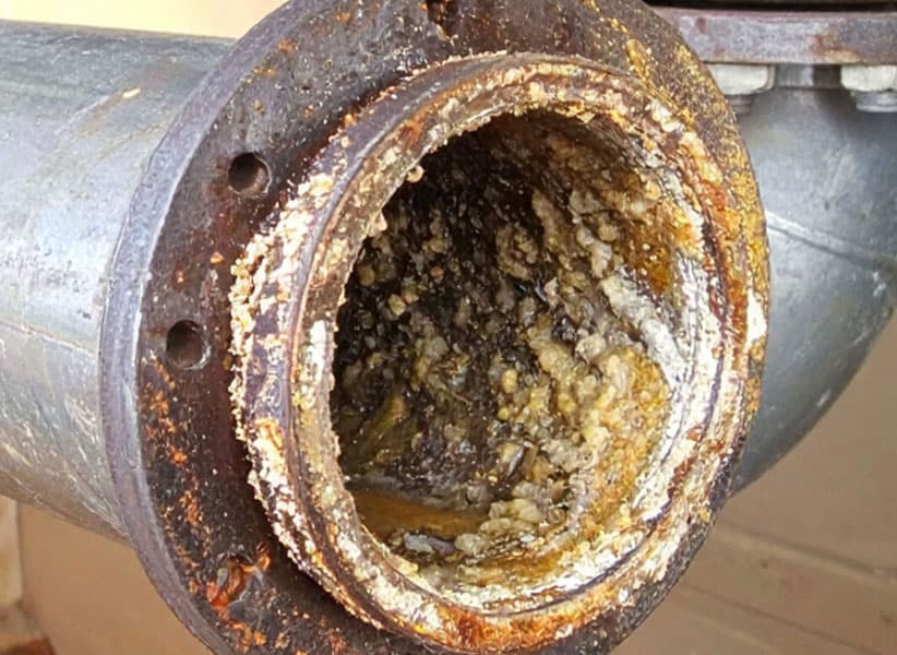 Biofilm Corrosion Control and Prevention - Corrosion in a pipe Blue Earth Products